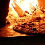 Close-up Photo of Pizza Near Bonfire
